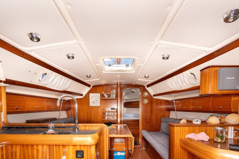 The bright salon of Yacht Pipit seen from the galley