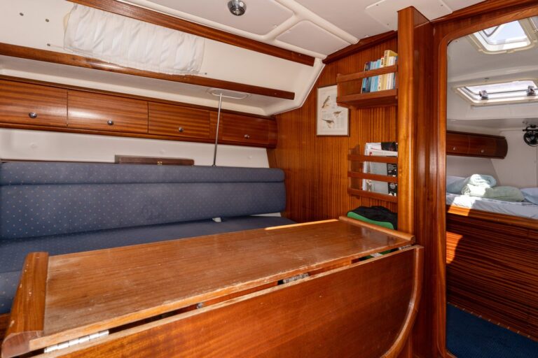 Salon and folding table aboard Yacht Pipit