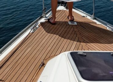 Barefoot on the teak foredeck