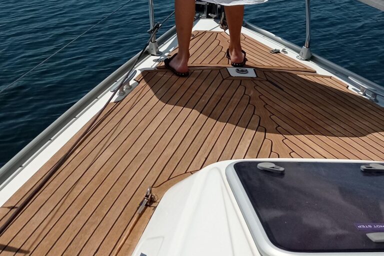 Barefoot on the teak foredeck