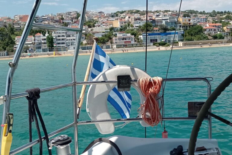 On deck, Greek flag flying