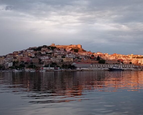 The old town of Kavala at golden hour, from the sea